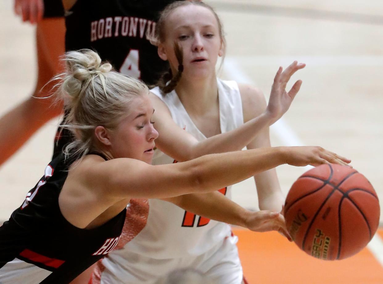 Hortonville's Paige Lillie, left, defends against Kaukauna's Savanna Robinson during their girls basketball game Dec. 15 in Kaukauna.