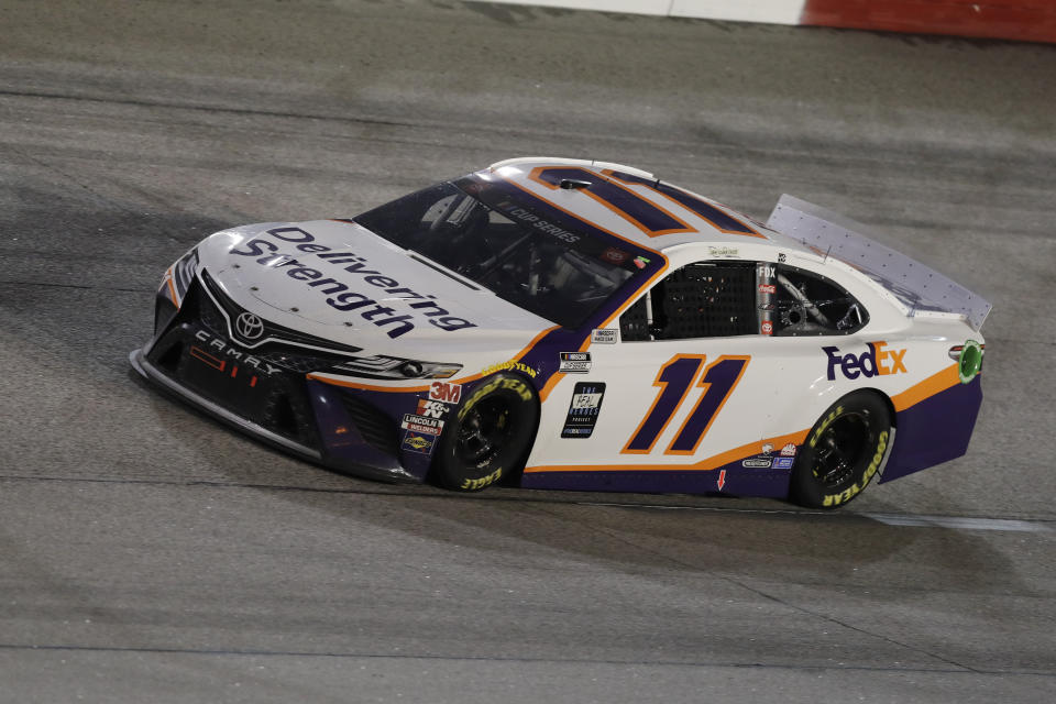 Denny Hamlin (11) drives during the NASCAR Cup Series auto race Wednesday, May 20, 2020, in Darlington, S.C. (AP Photo/Brynn Anderson)