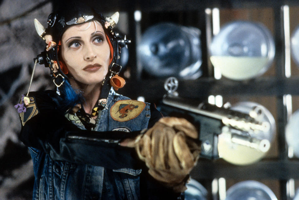 Lori Petty wearing bizarre head gear while holding a gun in a scene from the film 'Tank Girl', 1995. (Photo by United Artists/Getty Images)