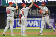 Los Angeles Angels first baseman Nolan Schanuel (18) third baseman Anthony Rendon (6) and center fielder Aaron Hicks (12) celebrate at the end of a baseball game against the Miami Marlins, Tuesday, April 2, 2024, in Miami. The Angels defeated the Marlins 3-1. (AP Photo/Marta Lavandier)