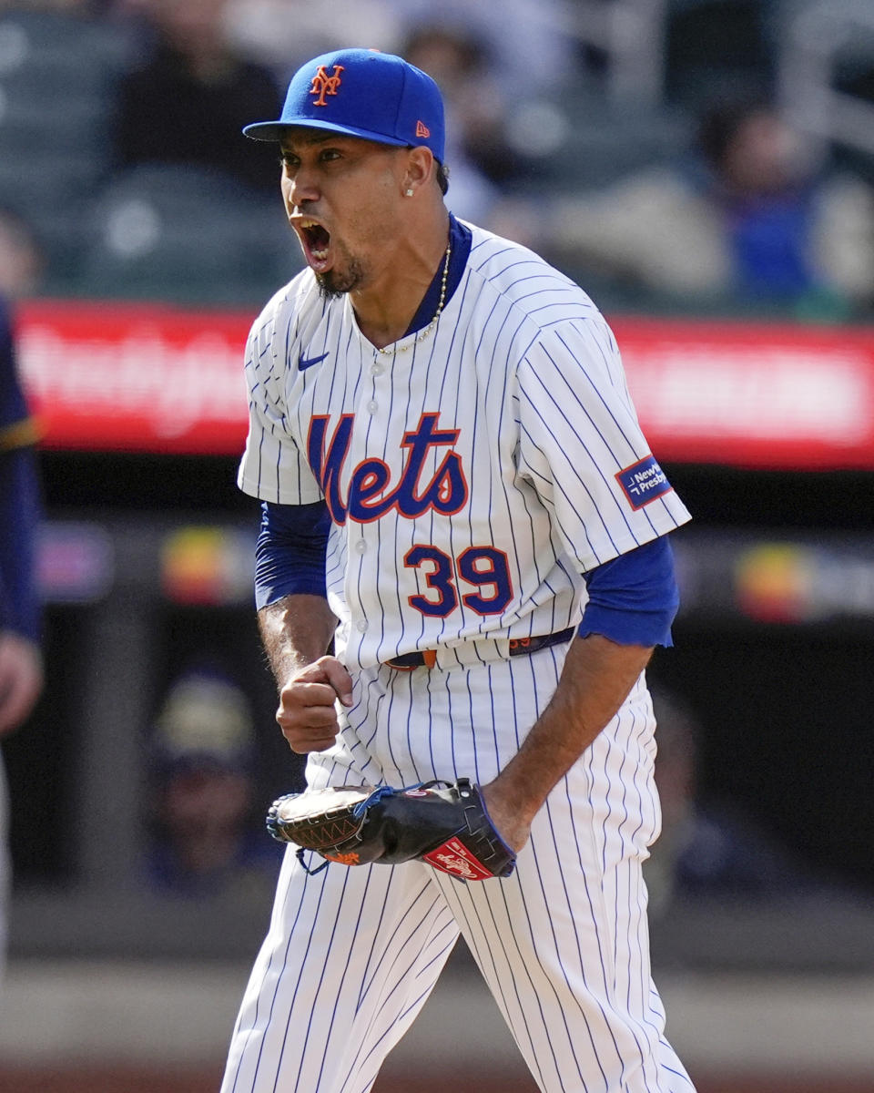 New York Mets relief pitcher Edwin Diaz (39) celebrates after strking out Milwaukee Brewers' Jackson Chourio during the ninth inning of a baseball game Saturday, March 30, 2024, in New York. (AP Photo/Frank Franklin II)