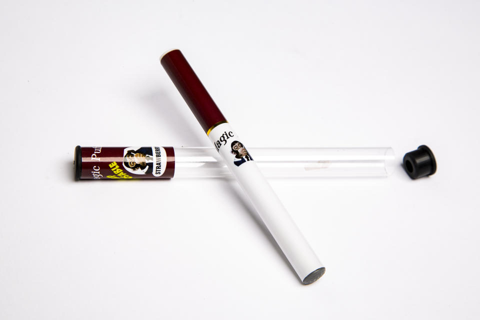 This Wednesday, July 17, 2019, photo shows a Magic Puff electronic cigarette and its packaging in Los Angeles. The product is labeled as a disposable hemp pen and was being sold as delivering the cannabis extract CBD at a store in Panama City, Florida, in July. Testing commissioned by The Associated Press as part of an investigation into CBD found it actually contained synthetic marijuana, a dangerous street drug commonly known as K2 or spice. (AP Photo/Damian Dovarganes)