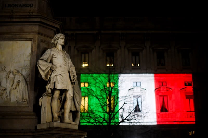 The Palazzo Marino building is seen iluminated with the colours of the Italian flag as the spread of coronavirus disease (COVID-19) continues, in Milan