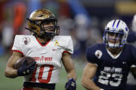 East wide receiver Malcolm Perry, of Navy, (10) runs past West safety Austin Lee, of BYU, (23) for a touchdown during the second half of the East West Shrine football game Saturday, Jan. 18, 2020, in St. Petersburg, Fla. (AP Photo/Chris O'Meara)