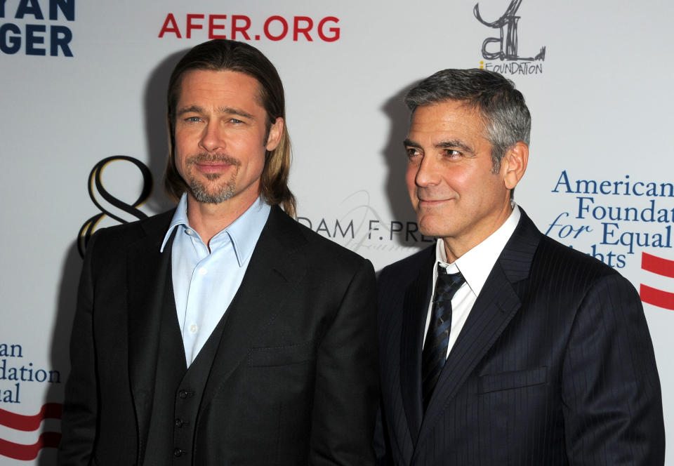 Brad Pitt and George Clooney arrive at the premiere of '8' presented by The American Foundation For Equal Rights & Broadway Impact on March 3, 2012. (Photo by Kevin Winter/Getty Images)