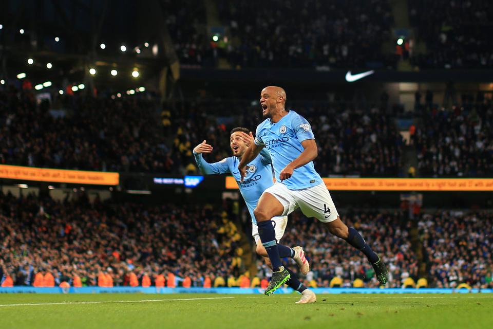 MANCHESTER, ENGLAND - MAY 06: Vincent Kompany of Manchester City celebrates after scoring his team's first goal with Bernardo Silva of Manchester City during the Premier League match between Manchester City and Leicester City at Etihad Stadium on May 06, 2019 in Manchester, United Kingdom. (Photo by Tom Flathers/Man City via Getty Images)