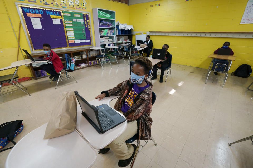 Jefferson County Elementary School children sit at desks and eat their school-supplied breakfasts in Fayette, Miss., on Wednesday, March 3, 2021. As one of the most food insecure counties in the United States, many families and their children have come to depend on these meals as their only means of daily sustenance. (AP Photo/Rogelio V. Solis)