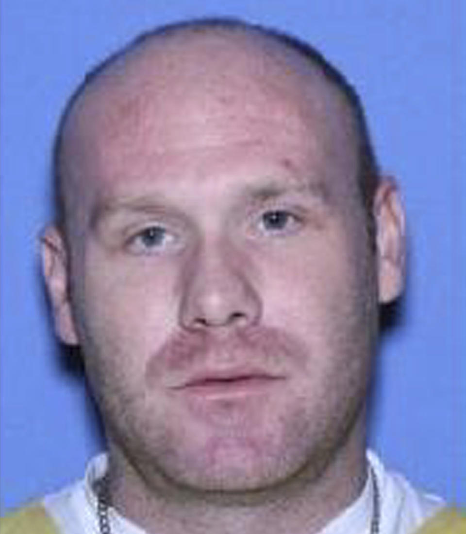 This undated photo provided by the U.S. Marshals shows Christopher Sanderson. Sanderson, the leader of a white supremacist gang and another inmate may have escaped from an Arkansas jail more than a day before anyone noticed, authorities say. Wesley Gullett and Sanderson were still on the run on Thursday, Aug. 1, 2019, three days after they were last seen at the Jefferson County Detention Center and a day after jailers realized they were missing, Sheriff Lafayette Woods Jr. said. (U.S. Marshals via AP)