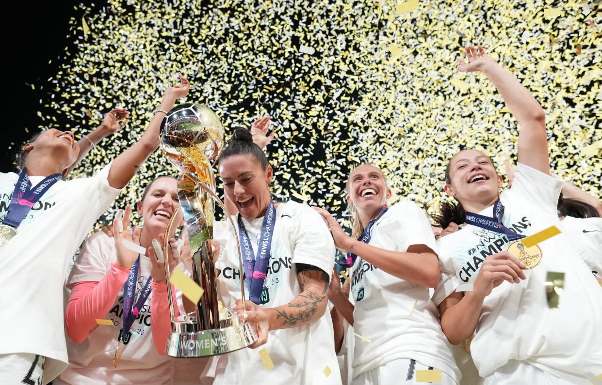 New Jersey/New York Gotham FC defender Ali Krieger hoists the trophy with her teammates after defeating the OL Reign in the NWSL Championship at Snapdragon Stadium on Nov 11, 2023 in San Diego.