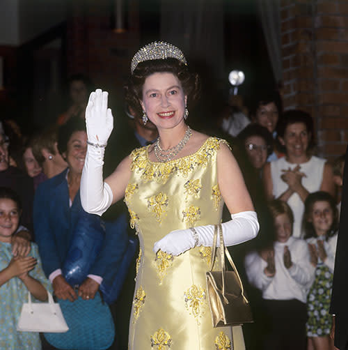 While visiting New Zealand in 1970 Queen Elizabeth waved to the admiring crowds, wearing her signature white elbow gloves and the Russian fringe tiara.