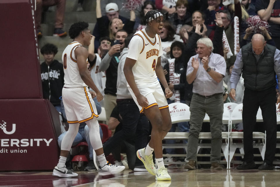 Santa Clara guard Adama Bal (4) celebrates with guard Brenton Knapper, left, after making the go-ahead basket during the second half of an NCAA college basketball game against Gonzaga in Santa Clara, Calif., Thursday, Jan. 11, 2024. (AP Photo/Jeff Chiu)