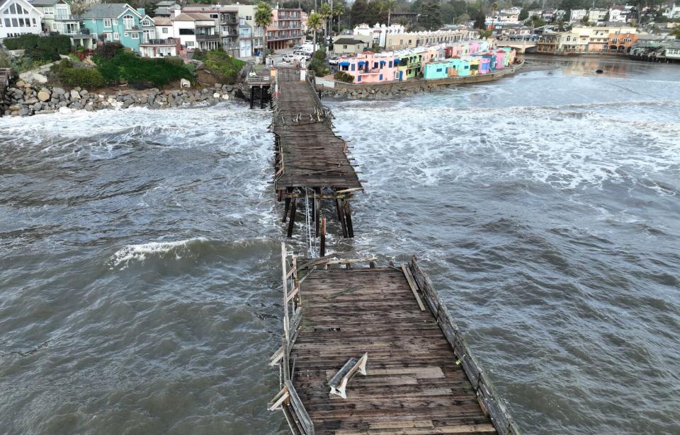 Part of the Capitola Wharf is missing following a powerful winter storm in Capitola, Calif.