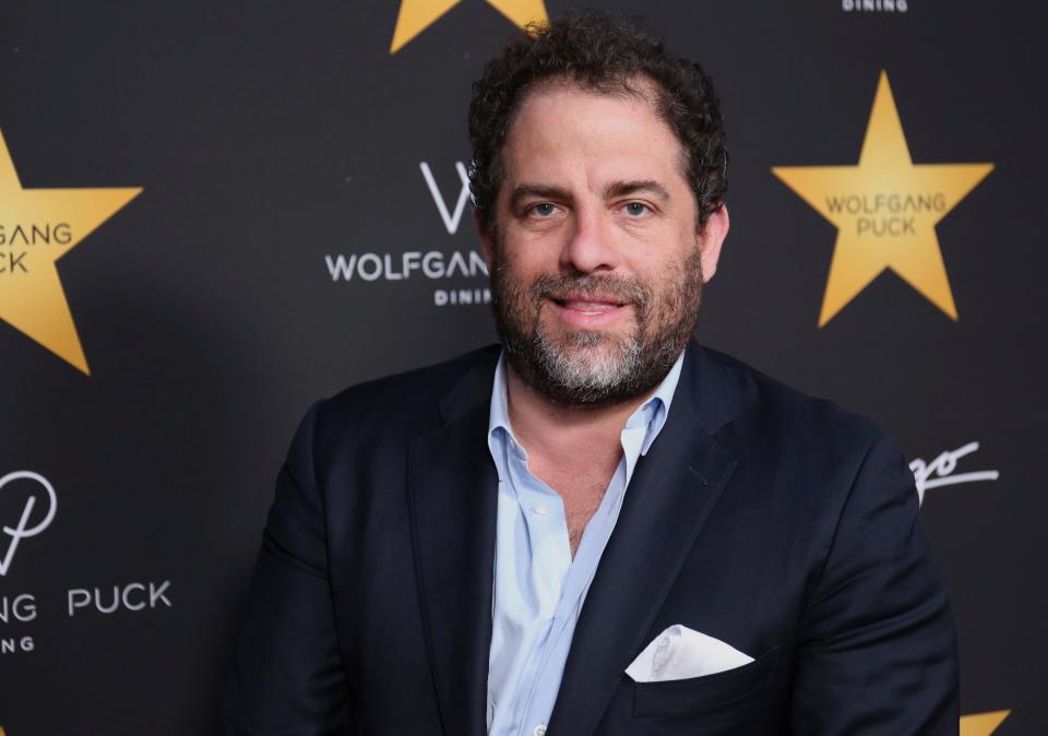 Brett Ratner, seen here in April 2017, has removed himself from any of his company's Warner Bros. projects and sued a woman over a Facebook post claiming he raped her.