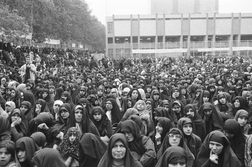 FILE - In this Nov. 5, 1979 file photo, a crowd of Iranian women wearing the traditional chador join an anti-U.S. protest in Tehran, Iran. Forty years ago on Nov. 4, 1979, Iranian students overran guards to take over the U.S. Embassy in Tehran, starting a 444-day hostage crisis that transfixed America. (AP Photo/GG, File)