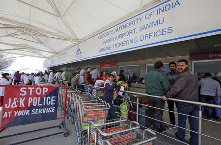 Passengers are seen at the ticket counters outside the airport after flights were cancelled following temporarily suspension of flights, in Jammu February 27, 2019. REUTERS/Mukesh Gupta