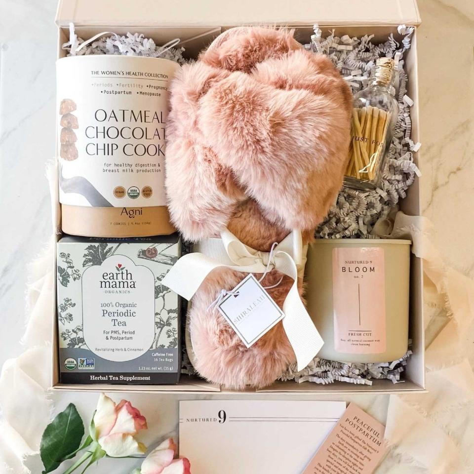 <p><a href="https://go.redirectingat.com?id=74968X1596630&url=https%3A%2F%2Fwww.nurtured9.com%2Fpregnancy-gift-box%2Fpeaceful-postpartum-gift-box&sref=https%3A%2F%2Fwww.cosmopolitan.com%2Fstyle-beauty%2Ffashion%2Fg37405085%2Fbest-gift-baskets-for-new-moms%2F" rel="nofollow noopener" target="_blank" data-ylk="slk:Shop Now;elm:context_link;itc:0;sec:content-canvas" class="link ">Shop Now</a></p><p>The Peaceful Postpartum New Mom Gift Box</p><p>$124.00</p><p>nurtured9.com</p><span class="copyright">Nurtured9</span>