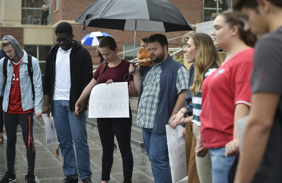 Students pray during a student protest Liberty University in Lynchburg, Va., Friday, Sept. 13, 2019. (Taylor Irby/The News & Advance via AP)