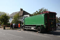 The scene of a collision in Broad Walk, Kidbrooke, south-east London, where the driver of a lorry which hit two cars before crashing into a house has died and an 11-year-old child is in a life-threatening condition in hospital.