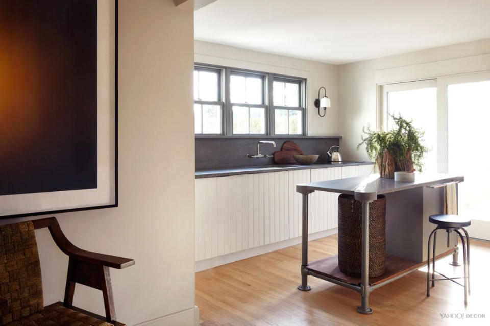 The new kitchen is complete. The custom island is made from an antique industrial work table.