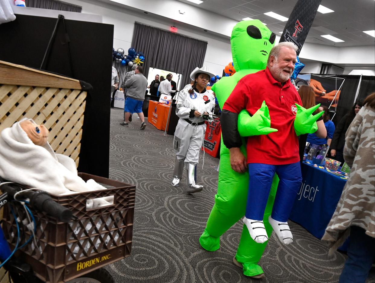 John Havard with OSI Security walks through Business Expo Wednesday wearing an inflatable alien costume. Held at the Abilene Convention Center, the theme for the annual Chamber of Commerce event was, “Business is Out of This World!”