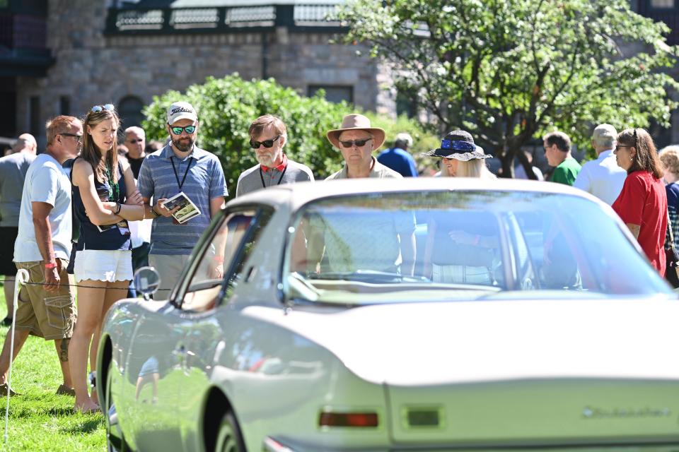 Attendees to the 2022 Concours D'Elegance at Copshaholm look over one of the entries. This year's event will be held July 8 at Studebaker National Museum in South Bend.