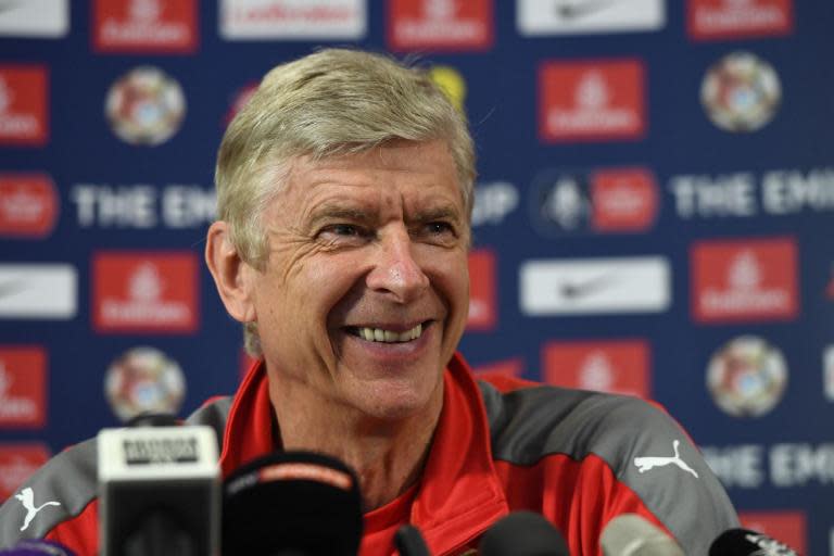 'You would never guess I am a football manager!' - Arsene Wenger has given away every medal won with Arsenal