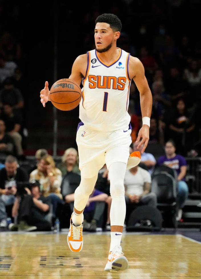 Phoenix Suns guard Devin Booker (1) against the Adelaide 36ers at Footprint Center in Phoenix on Oct. 2, 2022.