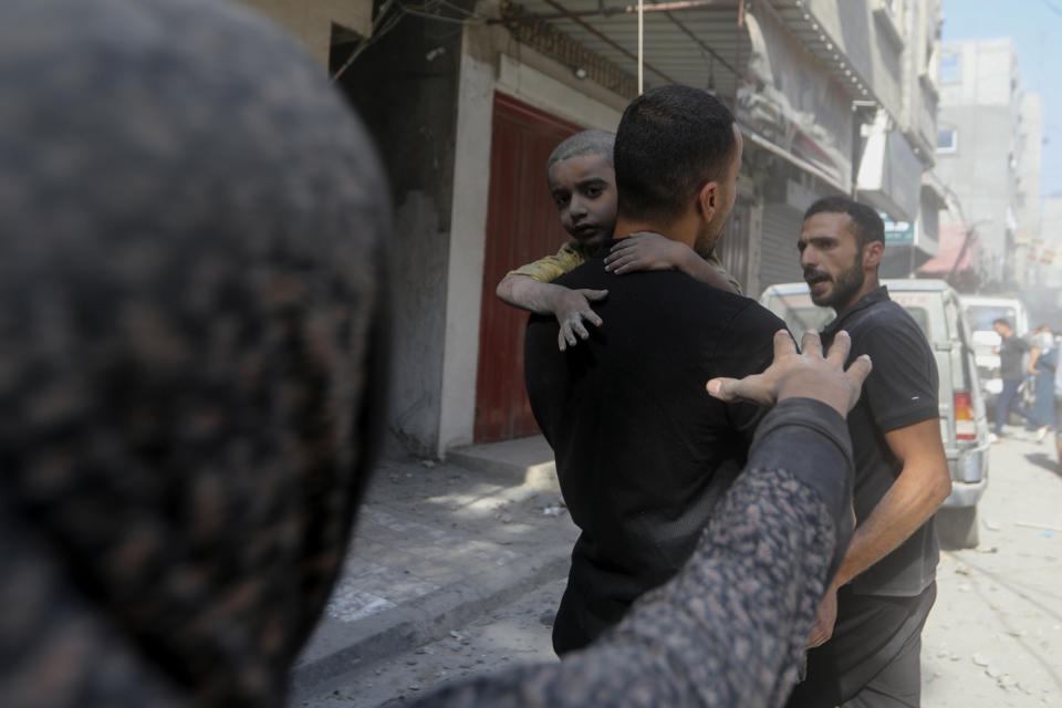 Palestinians evacuate wounded people following an Israeli airstrike in Bureij refugee camp, Gaza Strip, Thursday, Nov. 2, 2023. (AP Photo/Mohammed Dahman)