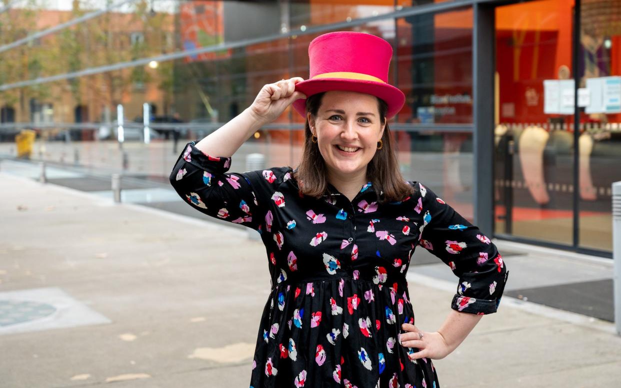 Theo Burrell wearing red top hat