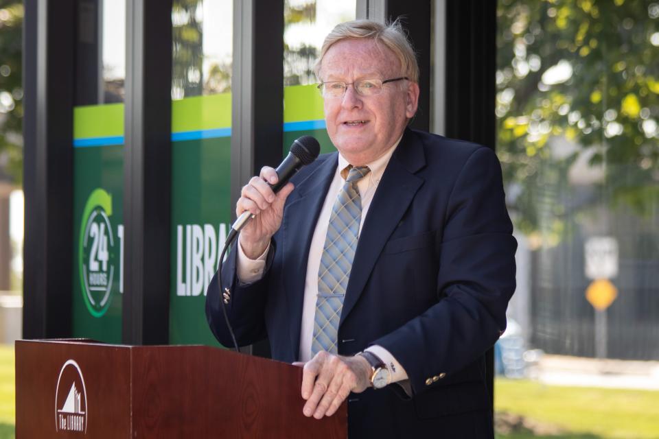 Springfield Mayor Ken McClure speaks during the unveiling ceremony of Library Express East, the district's new, 24-hour library kiosk. The outdoor kiosk is located in the parking lot of the Frisco Building at 3263 E. Chestnut Expressway.