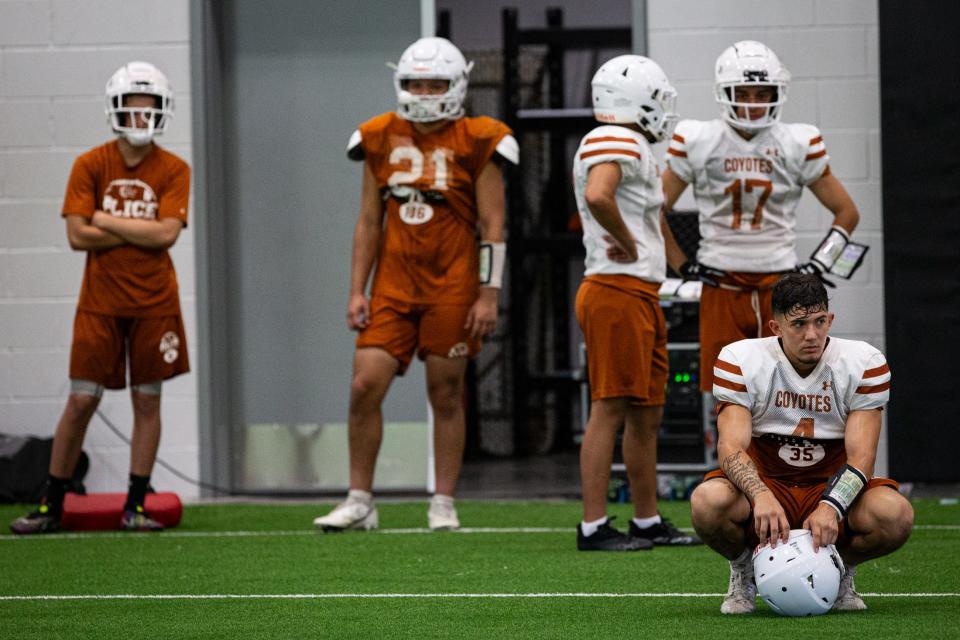 Alice wide receiver-running back Landon Rodriguez rests during practice at the high school on Aug. 2, 2023, in Alice, Texas.