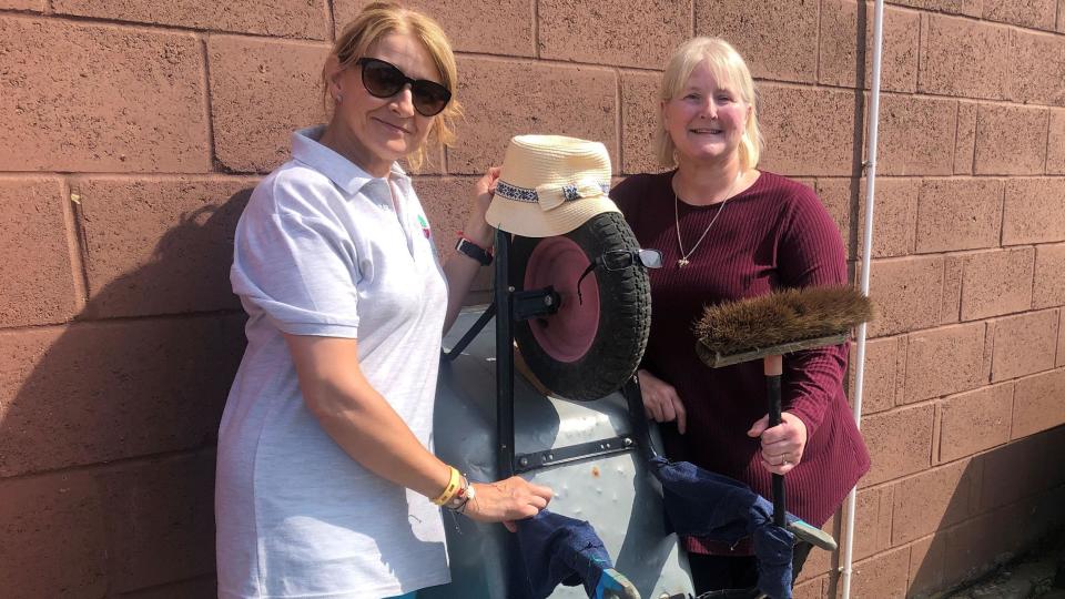 Lisa Madden and Alice Moss, volunteers at FACT community hub in March with the "wheel barrow" man they've named "Don".