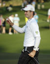 Kevin Streelman holds up his ball after a birdie on the second hole during the second round of the Masters golf tournament Friday, April 11, 2014, in Augusta, Ga. (AP Photo/Chris Carlson)