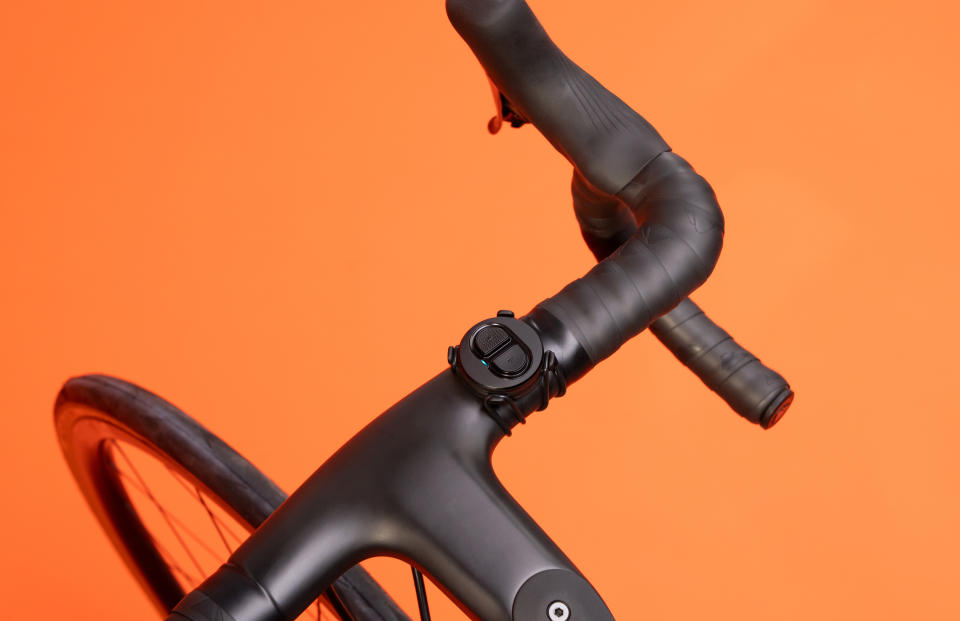 An overhead view of a bike's handlebars with the Zwift Click shift controller attached to them. It works in coordination with the company's new Zwift Hub One smart trainer.