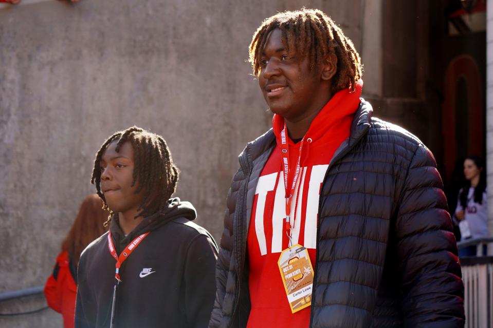 Recruit Carter Lowe watches Ohio State warm up before playing Penn State Oct. 21, 2023 at Ohio Stadium.