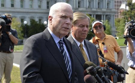 U.S. Senator John McCain (R-AZ), (L), makes remarks to the media as U.S. Senator Lindsey Graham (R-SC) listens, after meeting with U.S. President Barack Obama at the White House, on possible military action against Syria, in Washington September 2, 2013. REUTERS/Mike Theiler