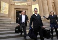 State prosecutor Gerrie Nel (L) leaves court after an appeal hearing brought by prosecutors against the six-year jail term handed to Oscar Pistorius for the murder of his girlfriend Reeva Steenkamp in Johannesburg, South Africa August 26, 2016. REUTERS/Siphiwe Sibeko