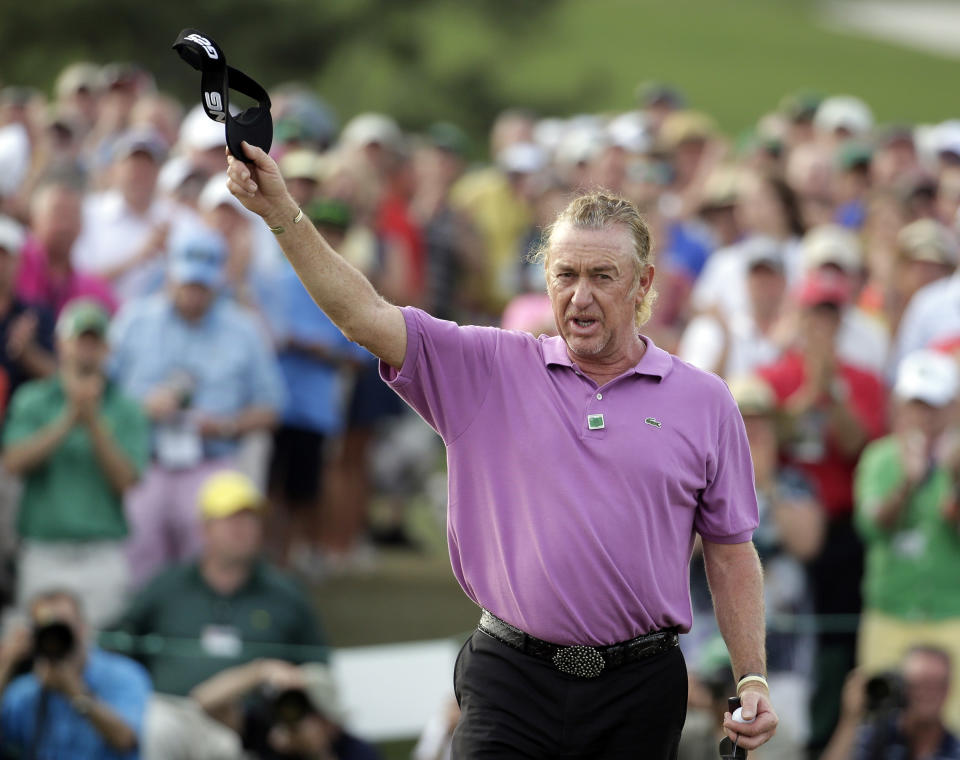 Miguel Angel Jimenez, of Spain, holds up his visor on the 18th hole following his fourth round of the Masters golf tournament Sunday, April 13, 2014, in Augusta, Ga. (AP Photo/Chris Carlson)