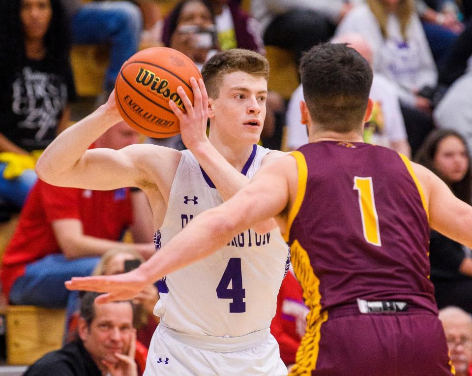South's Patrick Joyce (4) looks to pass by North's Nick Klaiber (1) during the Bloomington North versus Bloomington South boys basketball sectional final at Martinsville High School on Saturday, March 5, 2022.
