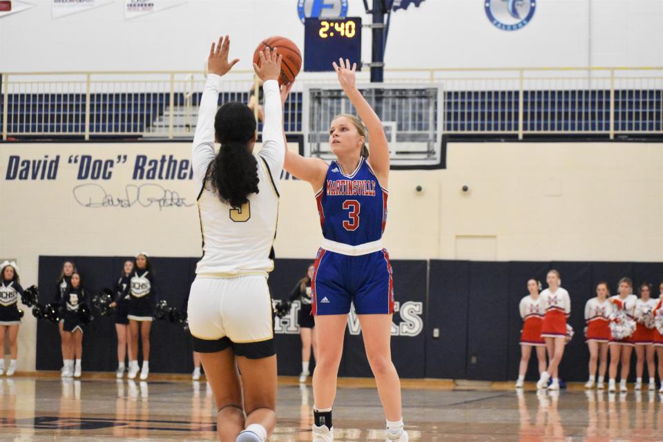 Martinsville's Holly Galyan (3) shoots over Decatur Central's Soriah Gouard (5) during the Artesians' matchup with the Hawks on Jan. 6, 2023.