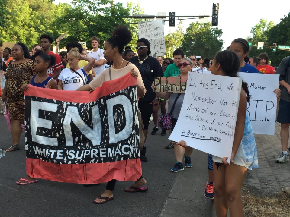 Children and adults protest in St. Paul, Minnesota on July 9, 2016.