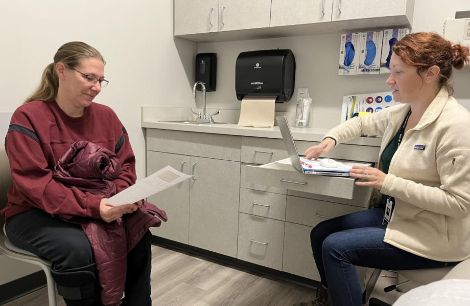 Bonnie Purk meets with nurse practitioner Andrea Storjohann at the Primary Health Care clinic (Courtesy Tony Leys/KHN)