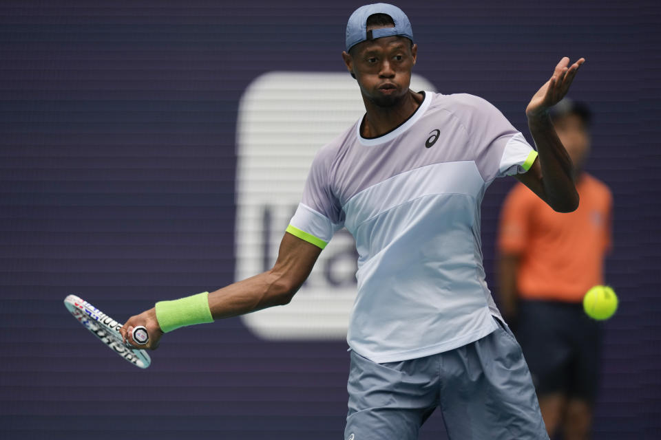 Christopher Eubanks returns a ball against Daniil Medvedev in their quarterfinal match at the Miami Open tennis tournament, Thursday, March 30, 2023, in Miami Gardens, Fla. (AP Photo/Rebecca Blackwell)