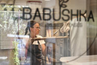 A worker makes pastries at Babushka Artisanal Bakery in Budapest, Hungary, Friday, Sept. 9, 2022. The gourmet bakery has raised its prices by 10% to keep up with rapidly rising costs of energy and raw materials, and taken steps to moderate its use of electricity to avoid having to close down. (AP Photo/Anna Szilagyi)