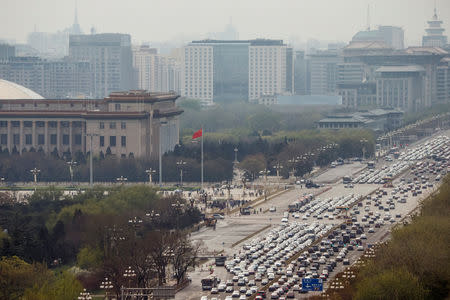 Cars line Chang'an Avenue at Tiananmen Square in Beijing, China April 9, 2019. REUTERS/Thomas Peter