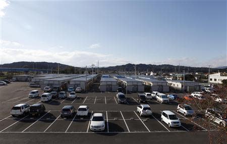 A view shows cars parked at the Izumitamatsuyu temporary housing estate, where 200 former Tomioka town residents have been evacuated to, in Iwaki, Fukushima prefecture November 8, 2013. REUTERS/Sophie Knight