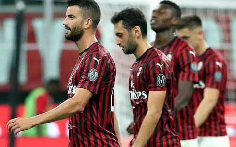 AC Milan players leave the pitch at half time during the Italian Serie A soccer match - Credit: MATTEO BAZZI/EPA-EFE/REX