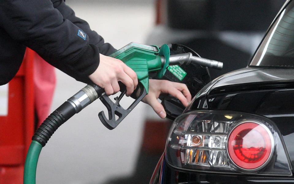 Person using a petrol pump - Lewis Whyld/PA