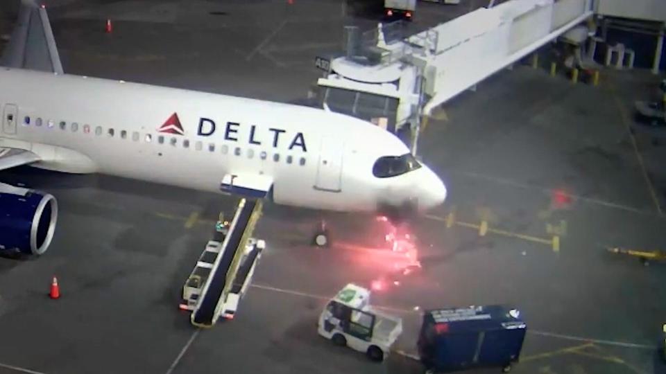 Plane catches fire at gate, prompting dozens to evacuate Delta aircraft