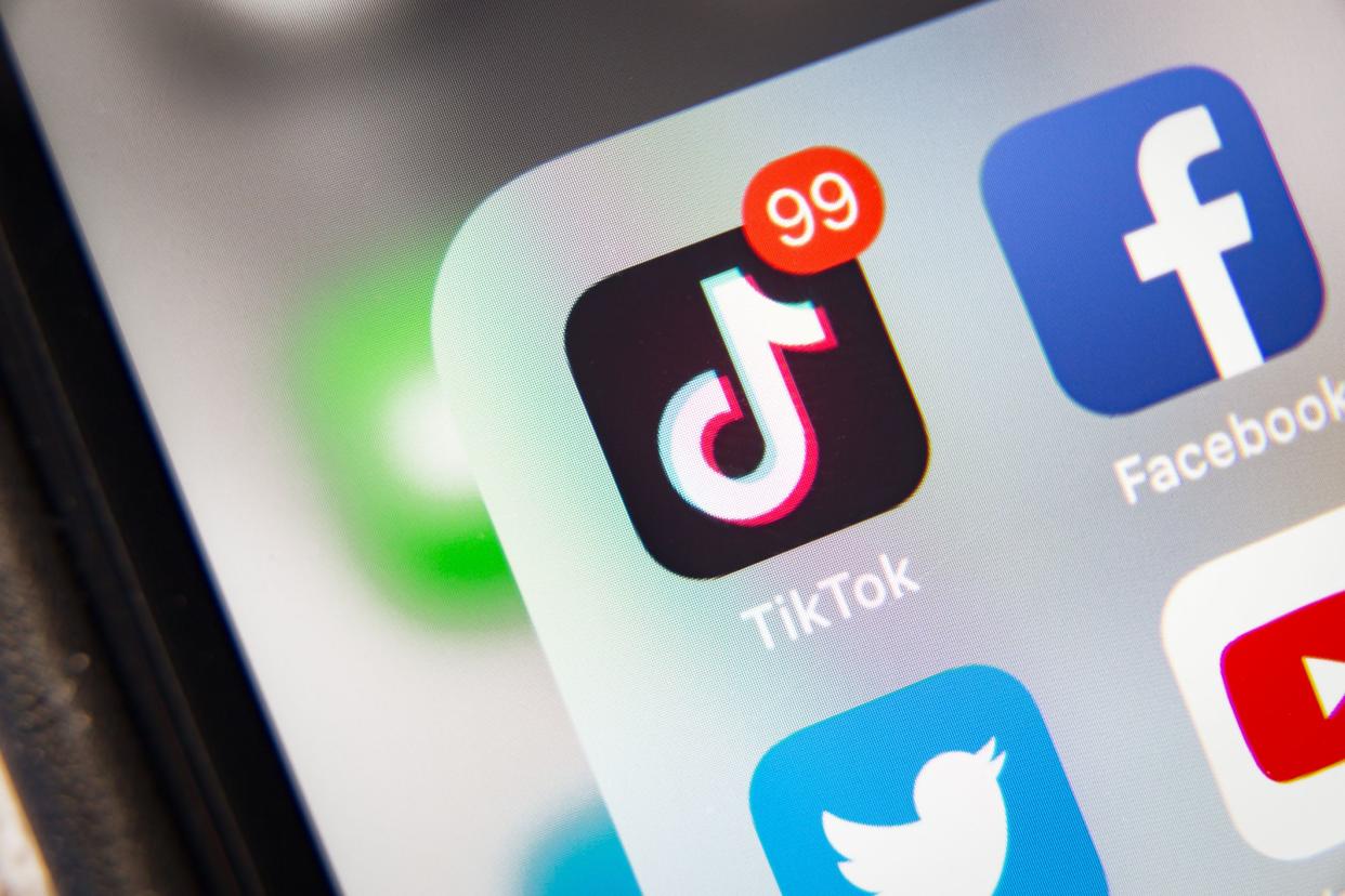 Tyumen, Russia - January 21, 2020: TikTok and Facebook application  on screen Apple iPhone XR